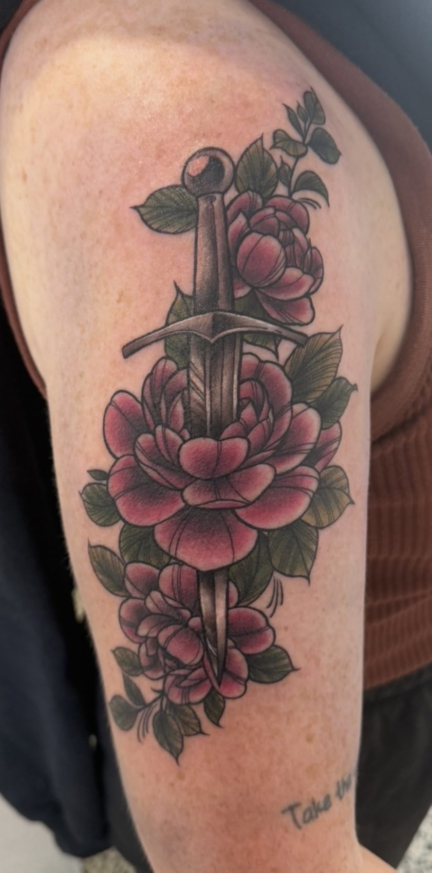 Neo-traditional red roses tattoo