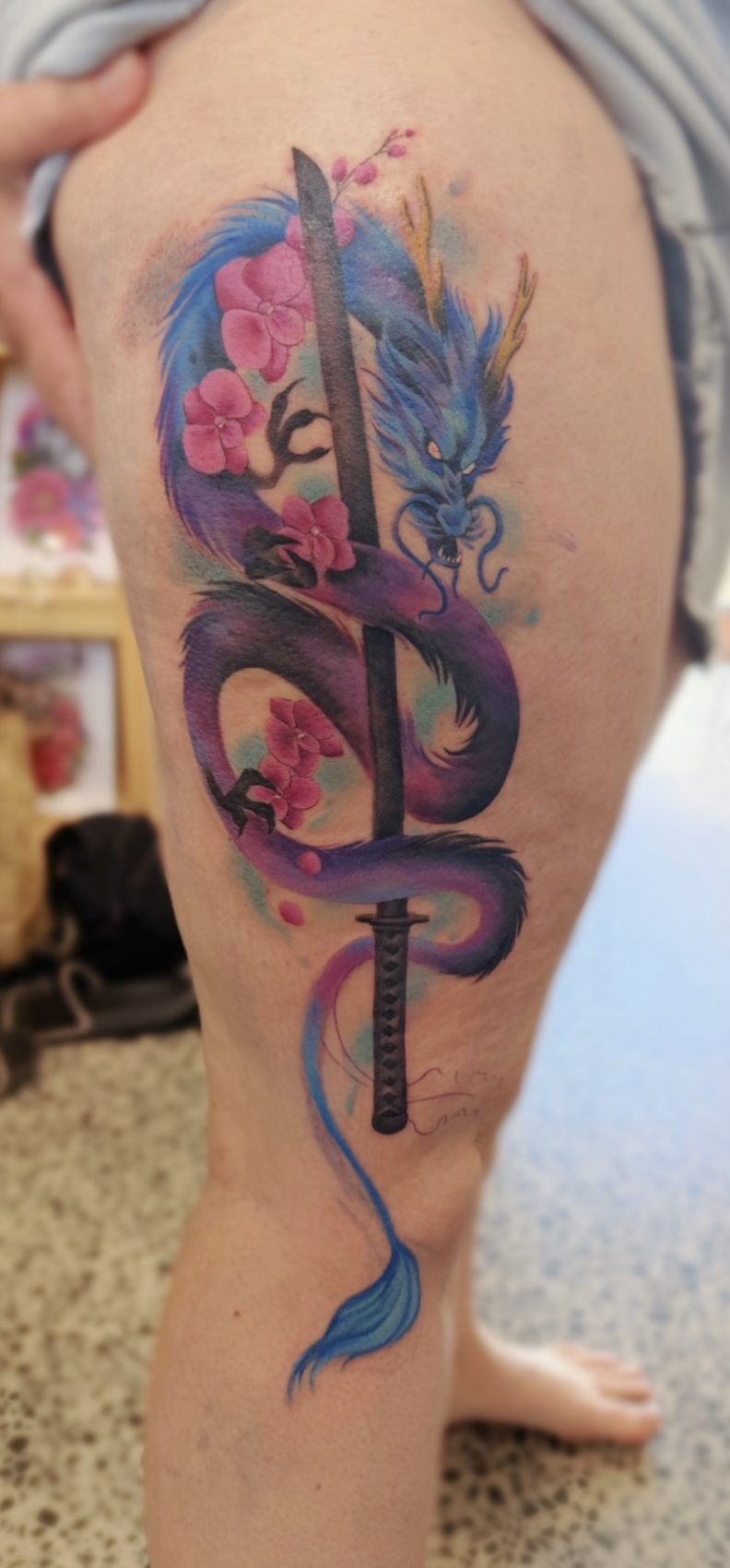 Colourful serpent tattoo with watercolour