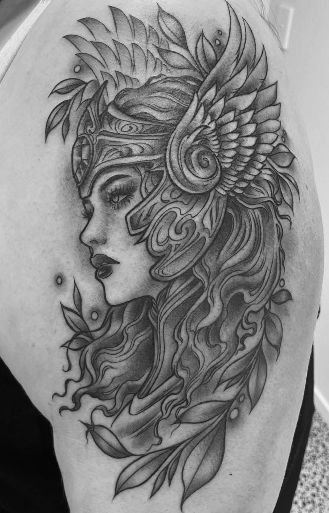 Fine line black and grey winged maiden tattoo