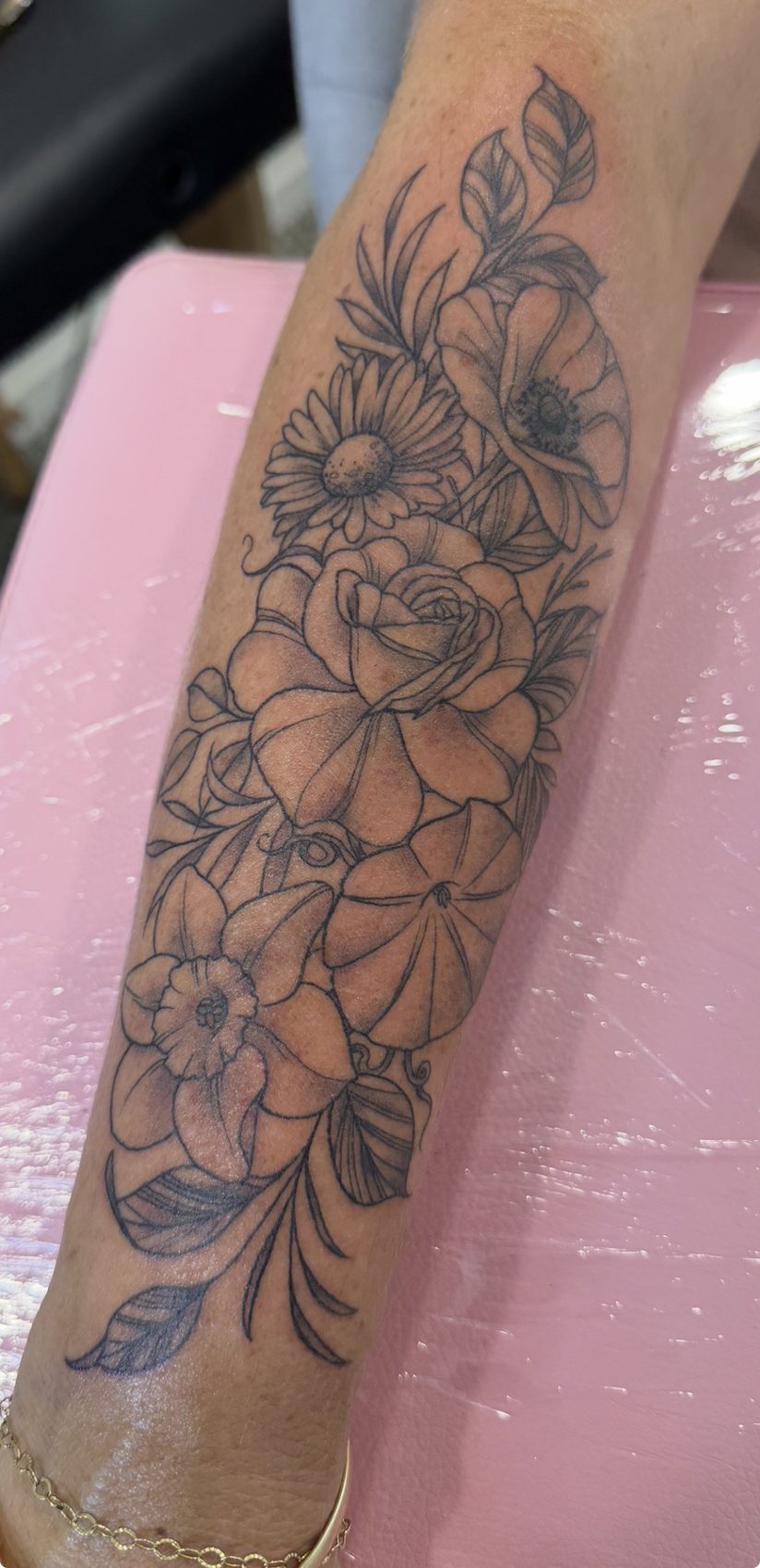 Colour floral forearm tattoo