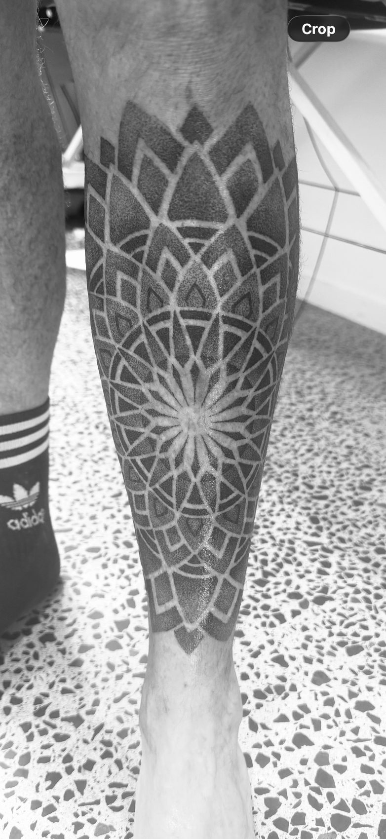 Ornamental geometric blackwork calf tattoo