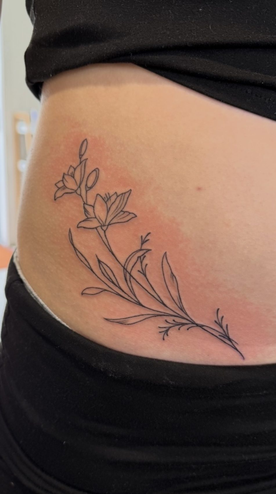Fine line botanical tattoo